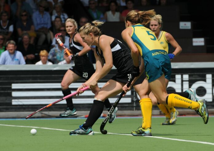Stacey Michelsen goes past Renee Trost in the 2011 Champions Trophy (c) Andy Smith