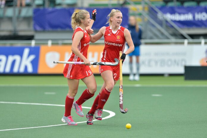 Susie Gilbert (r) celebrates her goal fpr England with Sophie Bray (c) hockeyimages.co.uk